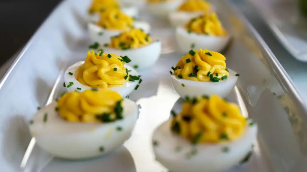 Low calorie devilled eggs filled with creamy cottage cheese and mustard mixture