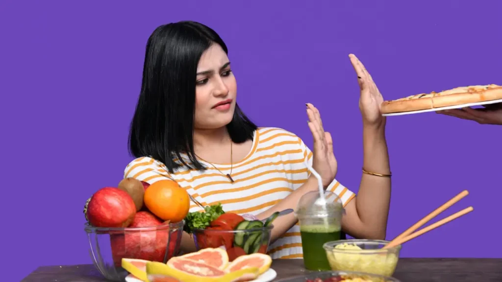 Gluten-Free Diet - Girl refusing a pizza