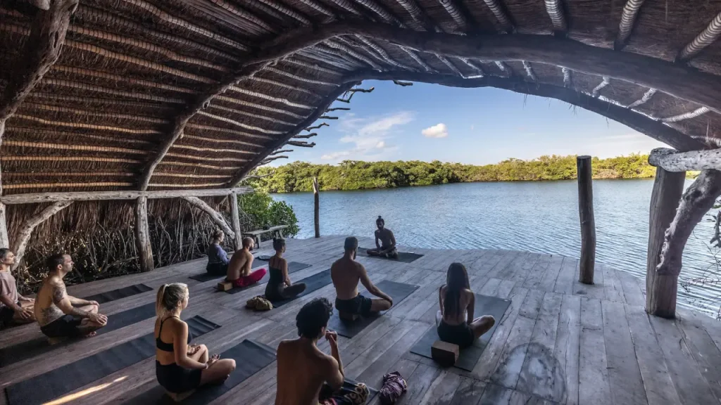 Meditation - People meditating overlooking a lake