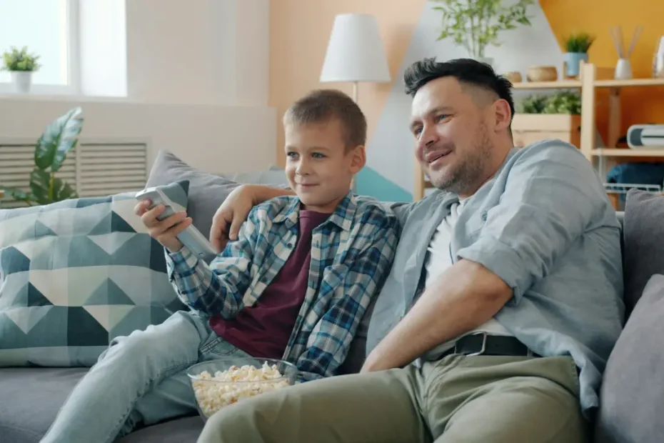 healthy snack recipes - father & son eating popcorn