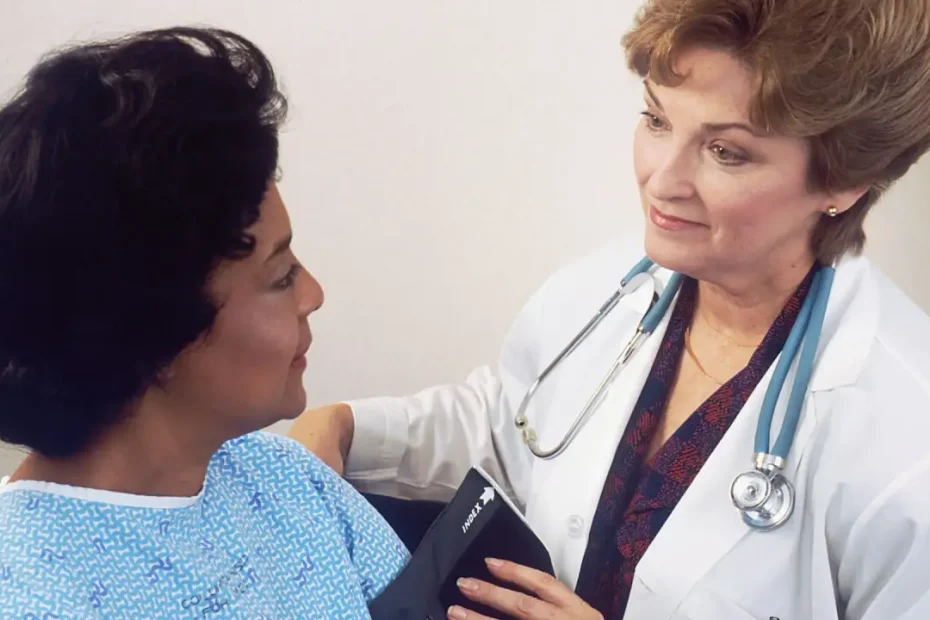 Healthcare professional discussing type 2 diabetes and blood glucose testing with a patient