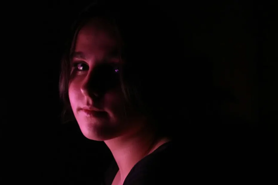 Young girl with facial redness associated with rosacea